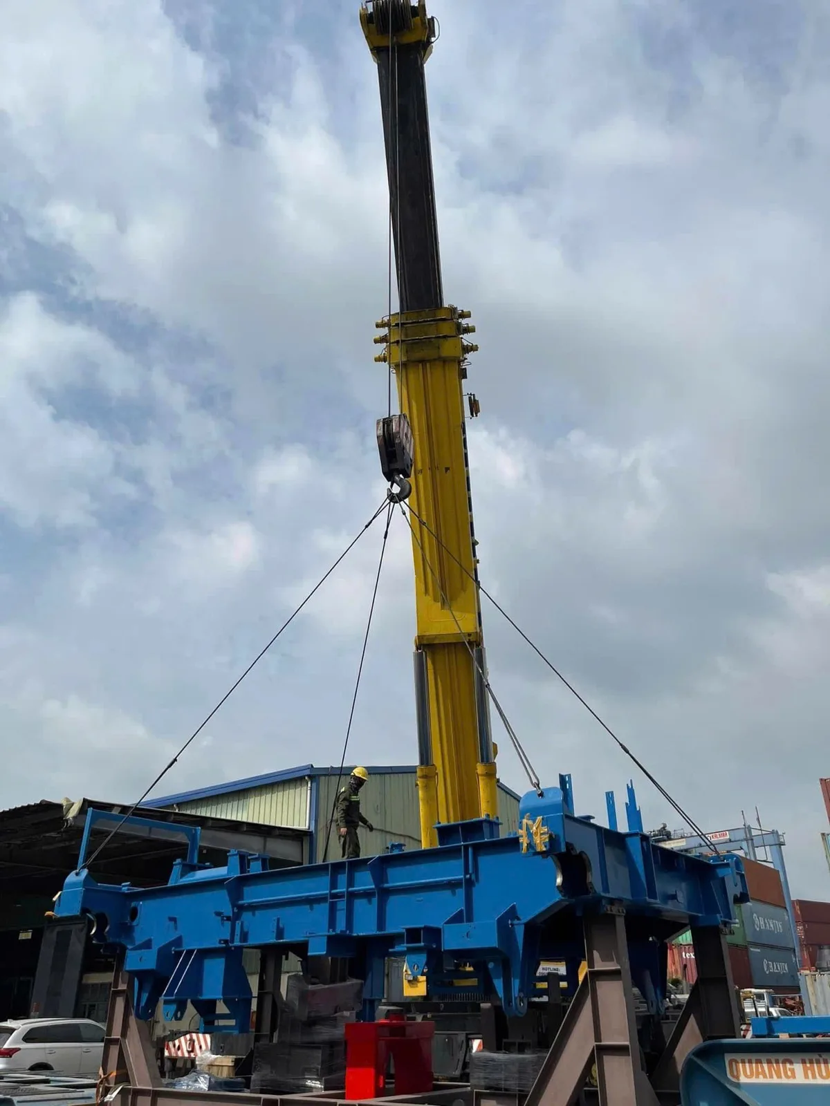 Mobile crane lifting oversized industrial equipment